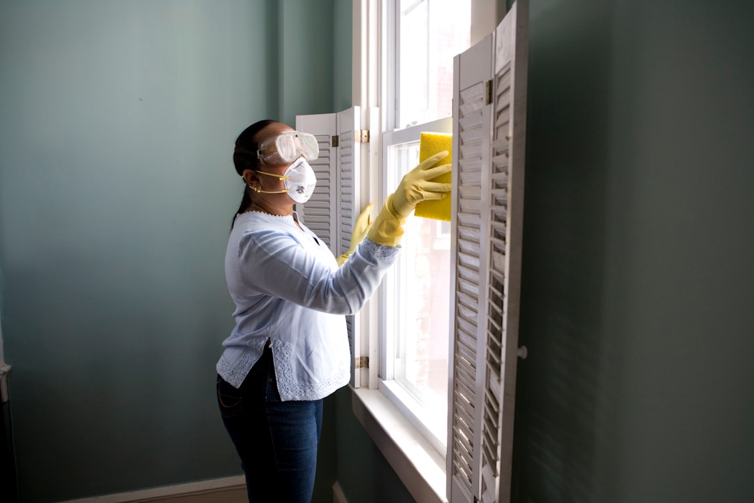 services-02 When renovating a home, you should use a damp sponge or cloth to clean dust collected on a window sill, as the dust may contain asbestos or lead-based paint. Home maintenance is an ongoing process for any homeowner, and here we see an African- American woman who’d taken a damp sponge to her window’s frame, in order to remove accumulated dust particulates. Note how the homeowner had donned a pair of waterproof gloves, a facemask, and a pair of goggles, prior to beginning this task.